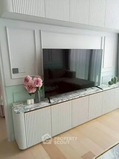 Elegant living room with modern TV setup and stylish decor