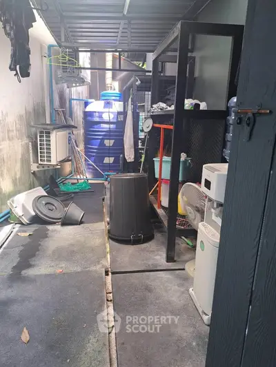 Utility area with storage and appliances in a residential property