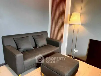 Cozy living room with modern sofa and stylish floor lamp