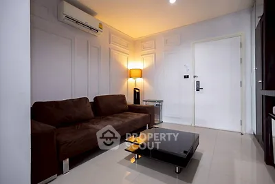 Modern living room with brown sofa and sleek coffee table