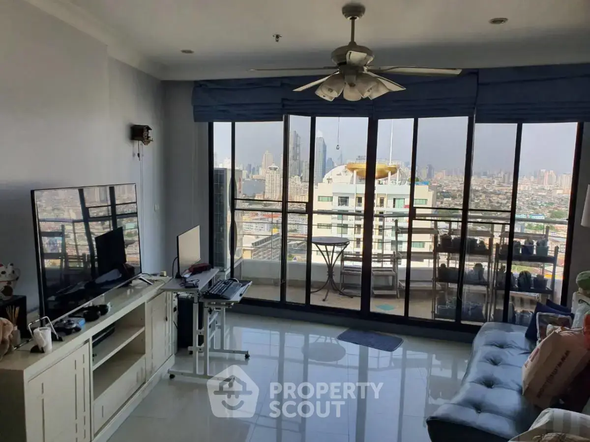 Spacious living room with stunning city view and large windows