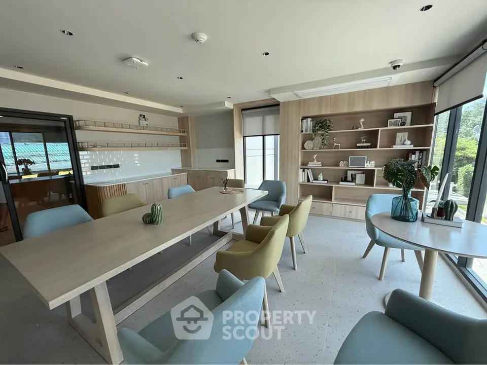 Spacious modern living room with elegant furniture and large windows