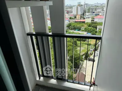 Charming balcony with cityscape view, perfect for relaxation and enjoying urban living.