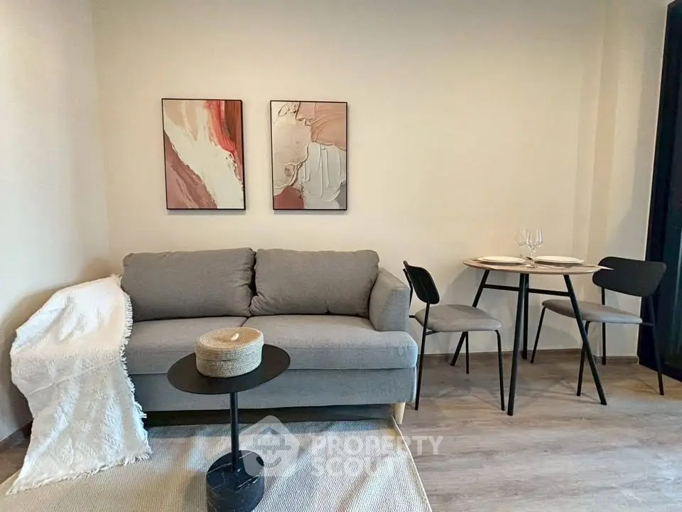 Cozy living room with modern decor and dining area, perfect for urban living.