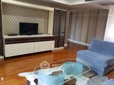 Spacious living room with modern decor and hardwood floors