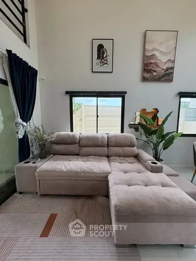 Stylish living room with modern decor and plush sectional sofa, perfect for relaxation and entertaining.