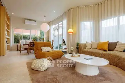 Spacious modern living room with stylish furniture and large windows