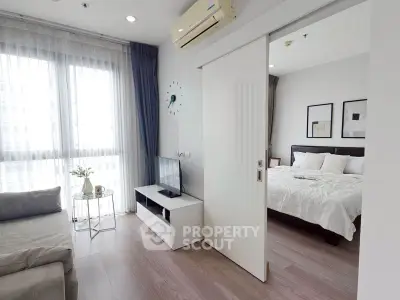 Modern apartment interior with cozy living room and elegant bedroom, featuring stylish decor and natural light.