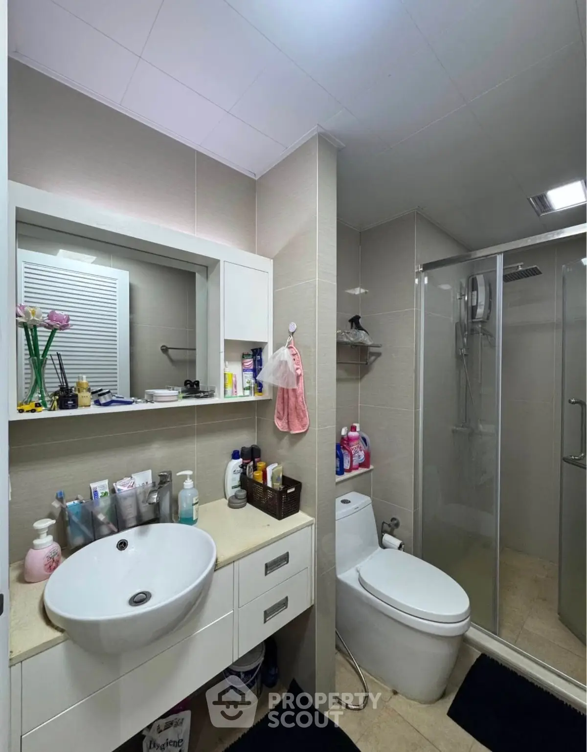 Modern bathroom with sleek fixtures and glass shower enclosure
