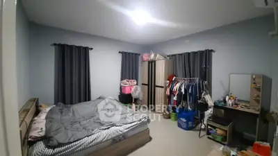 Spacious bedroom with modern decor and ample storage space