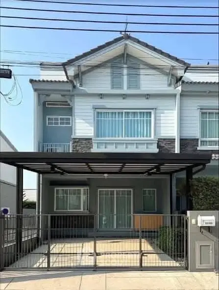 Charming modern townhouse with gated parking and stylish facade.