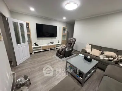 Cozy living room with modern decor and entertainment setup