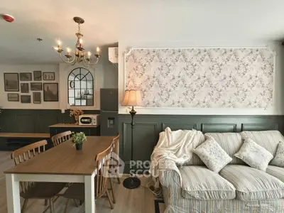 Charming living room with elegant decor, cozy sofa, and stylish dining area in a modern apartment.