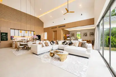 Luxurious open-plan living room with elegant decor and garden view