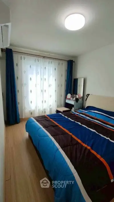 Cozy bedroom with modern decor and natural light