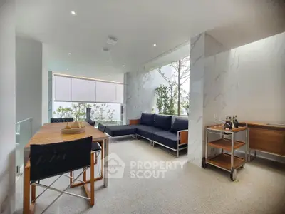 Modern living room with sleek furniture and natural light