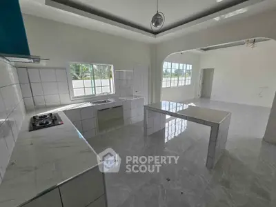 Spacious modern kitchen with sleek countertops and open layout design