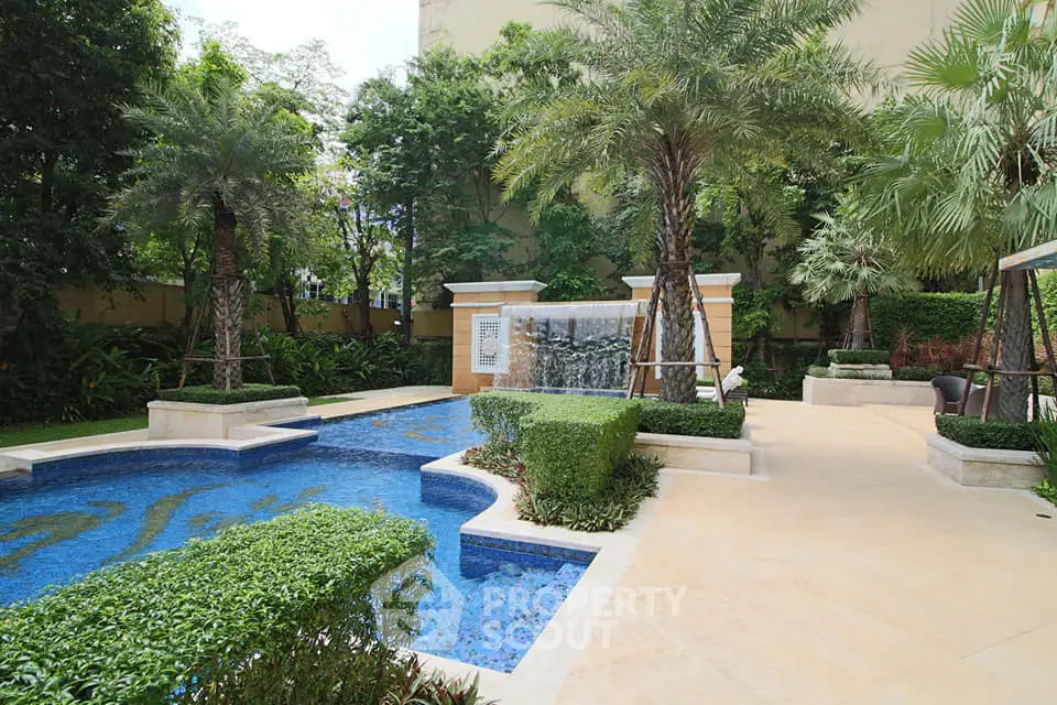 Luxurious outdoor pool area with lush greenery and elegant design
