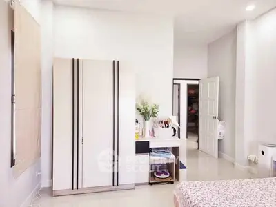 Spacious bedroom with modern wardrobe and elegant decor