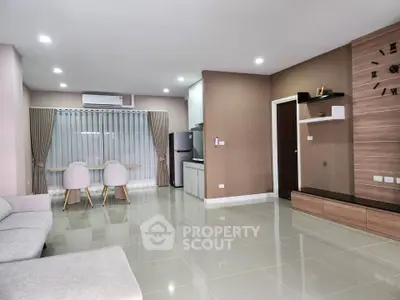Spacious modern living room with open kitchen and elegant decor