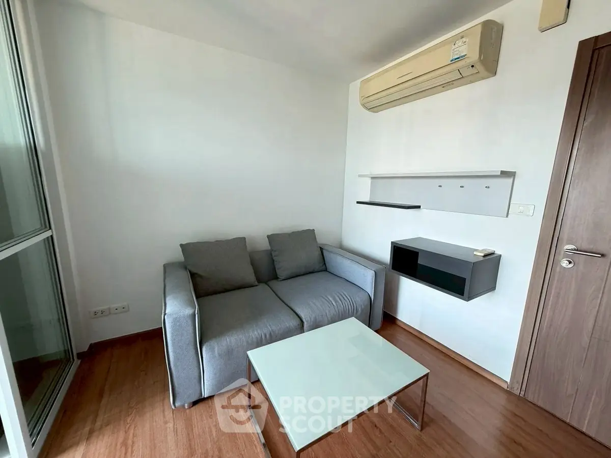 Modern living room with sleek furniture and air conditioning