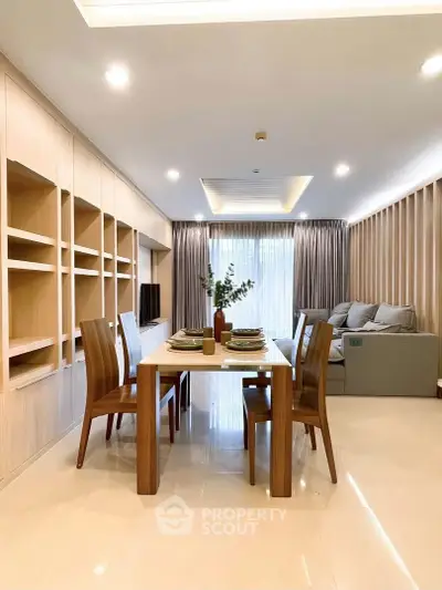 Elegant dining area with modern wooden furniture and built-in shelving, perfect for stylish living.
