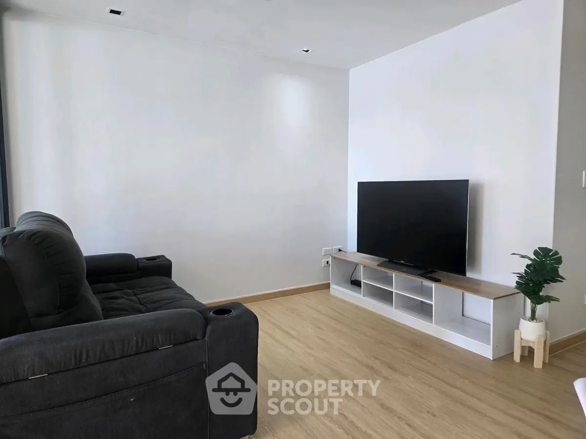 Modern living room with sleek TV setup and comfortable seating