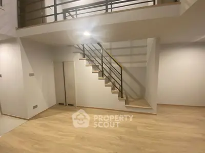 Spacious modern duplex with sleek staircase and open layout