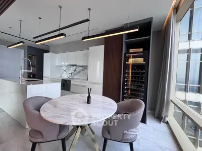 Luxurious modern kitchen with marble dining table and wine cooler