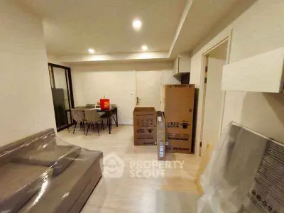 Spacious modern living room with dining area and new furniture in a contemporary apartment.