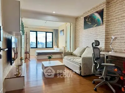 Modern studio apartment with city view, featuring cozy living area and stylish decor.