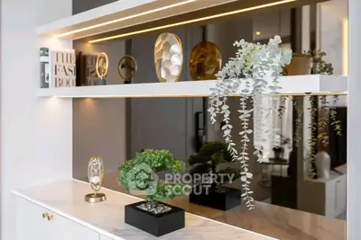 Modern interior decor with elegant shelving and stylish plants in a contemporary living space.