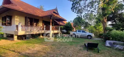 Charming Thai-style house with lush garden and spacious outdoor area, perfect for serene living.