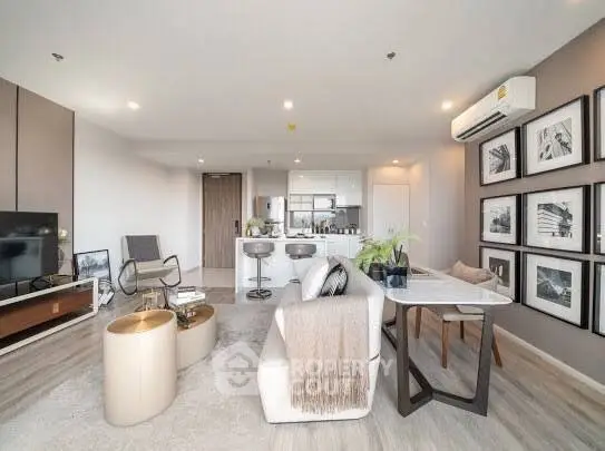 Spacious modern living room with open kitchen and stylish decor
