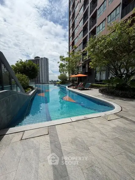 Luxurious apartment building with stunning outdoor pool and city view
