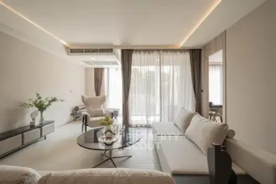 Spacious modern living room with elegant decor and large windows for natural light.