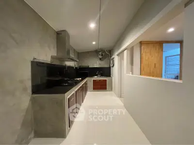 Modern kitchen with sleek design and gas stove in contemporary home