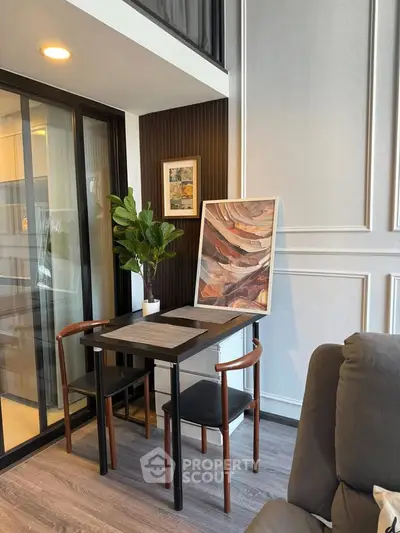 Modern living room with stylish decor and cozy seating area, featuring elegant wall paneling and contemporary furniture.