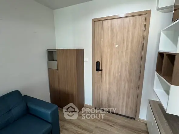Modern apartment entrance with wooden door and stylish furniture