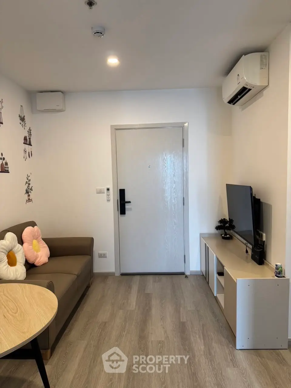 Cozy living room with modern decor and air conditioning