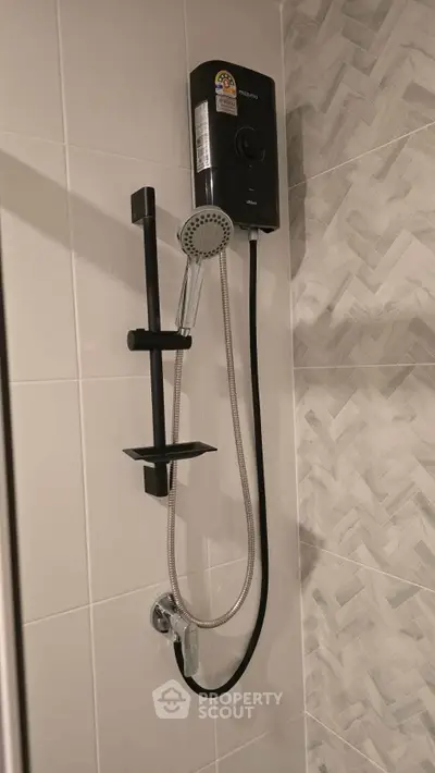 Modern bathroom shower with sleek design and water heater, perfect for contemporary living spaces.