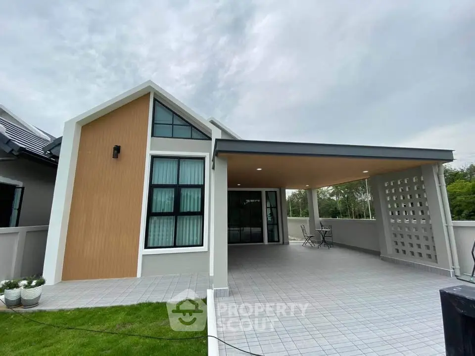 Modern single-story house with spacious carport and stylish facade