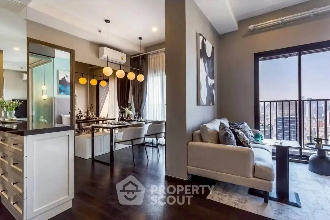 Modern open-plan living room with city view balcony, stylish decor, and elegant dining area.