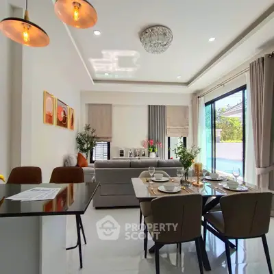 Modern living and dining area with elegant decor and natural light