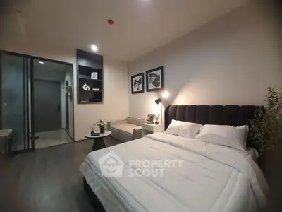 Modern bedroom with stylish decor and cozy lighting