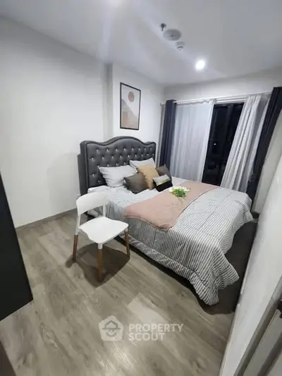 Cozy modern bedroom with stylish decor and natural light