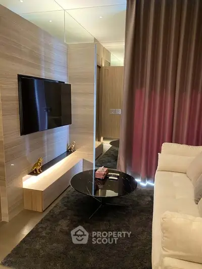 Luxurious modern living room with sleek TV setup and elegant decor
