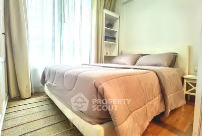 Cozy bedroom with natural light and elegant decor in modern apartment