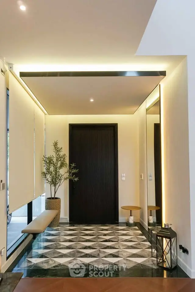 Luxurious modern entrance with stylish lighting and elegant decor