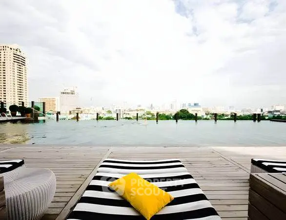 Luxurious rooftop pool with stunning city skyline view and stylish lounge chairs.